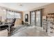 Large bonus room complete with an office setup, workout equipment, storage, and natural lighting at 1462 Rawhide St, Las Vegas, NV 89119