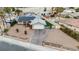 Charming home featuring a well-manicured lawn, solar panels, and inviting curb appeal at 1462 Rawhide St, Las Vegas, NV 89119