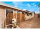 Beige house exterior shows windows and a pool pump, with access to a gate at 1462 Rawhide St, Las Vegas, NV 89119