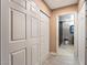 Hallway leading to a bathroom with a sliding door and a bedroom with a swinging door at 1462 Rawhide St, Las Vegas, NV 89119