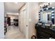 Hallway featuring tile floors, neutral colored walls, and access to the main bedroom at 1462 Rawhide St, Las Vegas, NV 89119