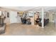 The spacious living room has tile flooring, neutral walls, and flows seamlessly into the dining area at 1462 Rawhide St, Las Vegas, NV 89119