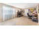 Cozy living room with tile floors, a modern fireplace, and a dedicated workspace at 1462 Rawhide St, Las Vegas, NV 89119