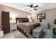 Comfortable main bedroom with a ceiling fan, neutral tones, and ample natural light at 1462 Rawhide St, Las Vegas, NV 89119