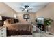 Comfortable main bedroom with a ceiling fan, neutral tones, and lots of natural light at 1462 Rawhide St, Las Vegas, NV 89119