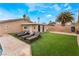 Private backyard features a sparkling pool and sun loungers, creating a tranquil space for relaxation and recreation at 1462 Rawhide St, Las Vegas, NV 89119