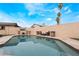 Enjoy the swimming pool with an outdoor tv and lush landscaping, creating a private backyard retreat at 1462 Rawhide St, Las Vegas, NV 89119