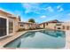 The backyard has a refreshing pool, sun loungers and patio space, creating an ideal setting for outdoor enjoyment at 1462 Rawhide St, Las Vegas, NV 89119
