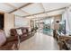 Bright sunroom with tile flooring, a comfortable seating area, and sliding glass doors to the pool at 1462 Rawhide St, Las Vegas, NV 89119