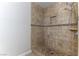 Neutral toned tile shower offers a built-in niche and adjustable shower head at 1560 Jamielinn Ln # 101, Las Vegas, NV 89110
