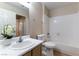 A bright bathroom features tile flooring and a shower-tub combo at 1560 Jamielinn Ln # 101, Las Vegas, NV 89110