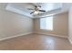 A cozy bedroom features neutral walls, a ceiling fan, and natural lighting at 1560 Jamielinn Ln # 101, Las Vegas, NV 89110