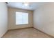 Bedroom featuring tile floors, a ceiling fan, and a large window at 1560 Jamielinn Ln # 101, Las Vegas, NV 89110