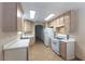 Bright kitchen featuring tile flooring, modern appliances, and bright white countertops at 1560 Jamielinn Ln # 101, Las Vegas, NV 89110