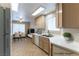 Bright kitchen with white countertops and cabinetry, and an adjacent dining area at 1560 Jamielinn Ln # 101, Las Vegas, NV 89110