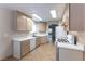 Bright kitchen featuring tile flooring, modern appliances, and bright white countertops at 1560 Jamielinn Ln # 101, Las Vegas, NV 89110