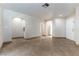 Open floor plan featuring tile flooring, arched entryways, and access to other rooms at 1560 Jamielinn Ln # 101, Las Vegas, NV 89110