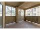 A covered outdoor patio featuring neutral tiling and metal framed view to exterior at 1560 Jamielinn Ln # 101, Las Vegas, NV 89110