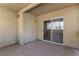 Sliding glass door grants entrance to a neutral tiled outdoor patio space at 1560 Jamielinn Ln # 101, Las Vegas, NV 89110