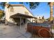 Backyard features a covered patio, spa, and ample space for outdoor activities and relaxation at 1903 Ginger Blossom Ave, North Las Vegas, NV 89031