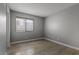 Bedroom featuring tile floors, a window with blinds, and standard baseboards at 1903 Ginger Blossom Ave, North Las Vegas, NV 89031