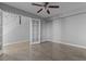 Bedroom featuring tile floors, ceiling fan, and door to the hallway at 1903 Ginger Blossom Ave, North Las Vegas, NV 89031