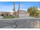 Charming two-story home boasts a three-car garage and well-maintained landscaping at 1903 Ginger Blossom Ave, North Las Vegas, NV 89031