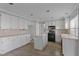 Traditional eat-in kitchen featuring black appliances, white cabinets and a kitchen island at 1903 Ginger Blossom Ave, North Las Vegas, NV 89031