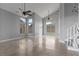 Bright living room features high ceilings, neutral walls, decorative ceiling fan and tile flooring at 1903 Ginger Blossom Ave, North Las Vegas, NV 89031