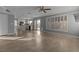 Spacious living room with tile flooring, ceiling fan, and sliding doors to the backyard at 1903 Ginger Blossom Ave, North Las Vegas, NV 89031