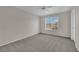 Bedroom featuring neutral carpet, ceiling fan, and window with blinds at 1909 Mountain Hills Ct # 103, Las Vegas, NV 89128