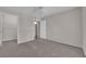 Bedroom with plush carpeting, a ceiling fan, and access to a walk-in closet at 1909 Mountain Hills Ct # 103, Las Vegas, NV 89128