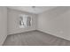 Bedroom with plush carpeting, a ceiling fan, and a window offering natural light at 1909 Mountain Hills Ct # 103, Las Vegas, NV 89128