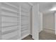 Spacious walk-in closet with built-in shelving and hanging rods for optimal organization at 1909 Mountain Hills Ct # 103, Las Vegas, NV 89128