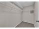 A carpeted walk-in closet features wire shelving for efficient storage at 1909 Mountain Hills Ct # 103, Las Vegas, NV 89128