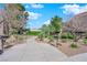 This common area features well maintained landscaping, trees and a paved sidewalk at 1909 Mountain Hills Ct # 103, Las Vegas, NV 89128