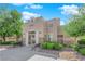 Attractive community building with desert landscaping, seating, and covered entry on a bright, sunny day at 1909 Mountain Hills Ct # 103, Las Vegas, NV 89128