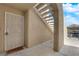 View of a secure condo entrance with a steel security door and covered stairway at 1909 Mountain Hills Ct # 103, Las Vegas, NV 89128