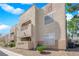 Condo building exterior showing address and individual units with balconies and stairways at 1909 Mountain Hills Ct # 103, Las Vegas, NV 89128