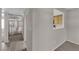 Hallway showing access to various rooms, with wood-style flooring at 1909 Mountain Hills Ct # 103, Las Vegas, NV 89128