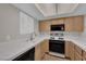 Bright kitchen featuring a window with a white tile countertop at 1909 Mountain Hills Ct # 103, Las Vegas, NV 89128