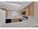 Bright kitchen features tile countertops and standard appliances at 1909 Mountain Hills Ct # 103, Las Vegas, NV 89128