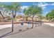 Neighborhood swing set offering a relaxing and enjoyable activity for children in a beautifully landscaped setting at 1909 Mountain Hills Ct # 103, Las Vegas, NV 89128