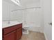 Well-lit bathroom with a large vanity, toilet, and bathtub with shower at 2251 Wigwam Pkwy # 314, Henderson, NV 89074
