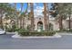 A view of the clubhouse from the street, surrounded by trees at 2251 Wigwam Pkwy # 314, Henderson, NV 89074