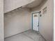 A secure exterior entrance featuring a solid white door with a decorative glass window at 2251 Wigwam Pkwy # 314, Henderson, NV 89074
