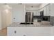 Modern kitchen featuring stainless steel appliances, gray cabinets, and sleek granite countertops at 2251 Wigwam Pkwy # 314, Henderson, NV 89074