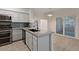 Bright kitchen boasts stainless steel appliances, modern countertops, and a stylish backsplash at 2251 Wigwam Pkwy # 314, Henderson, NV 89074