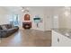 Bright living room with fireplace, ceiling fan, and comfortable couch at 2251 Wigwam Pkwy # 314, Henderson, NV 89074
