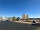 Scenic street view with desert landscape and hotel in the background on a clear day at 230 Sundance Shores Dr, Laughlin, NV 89029